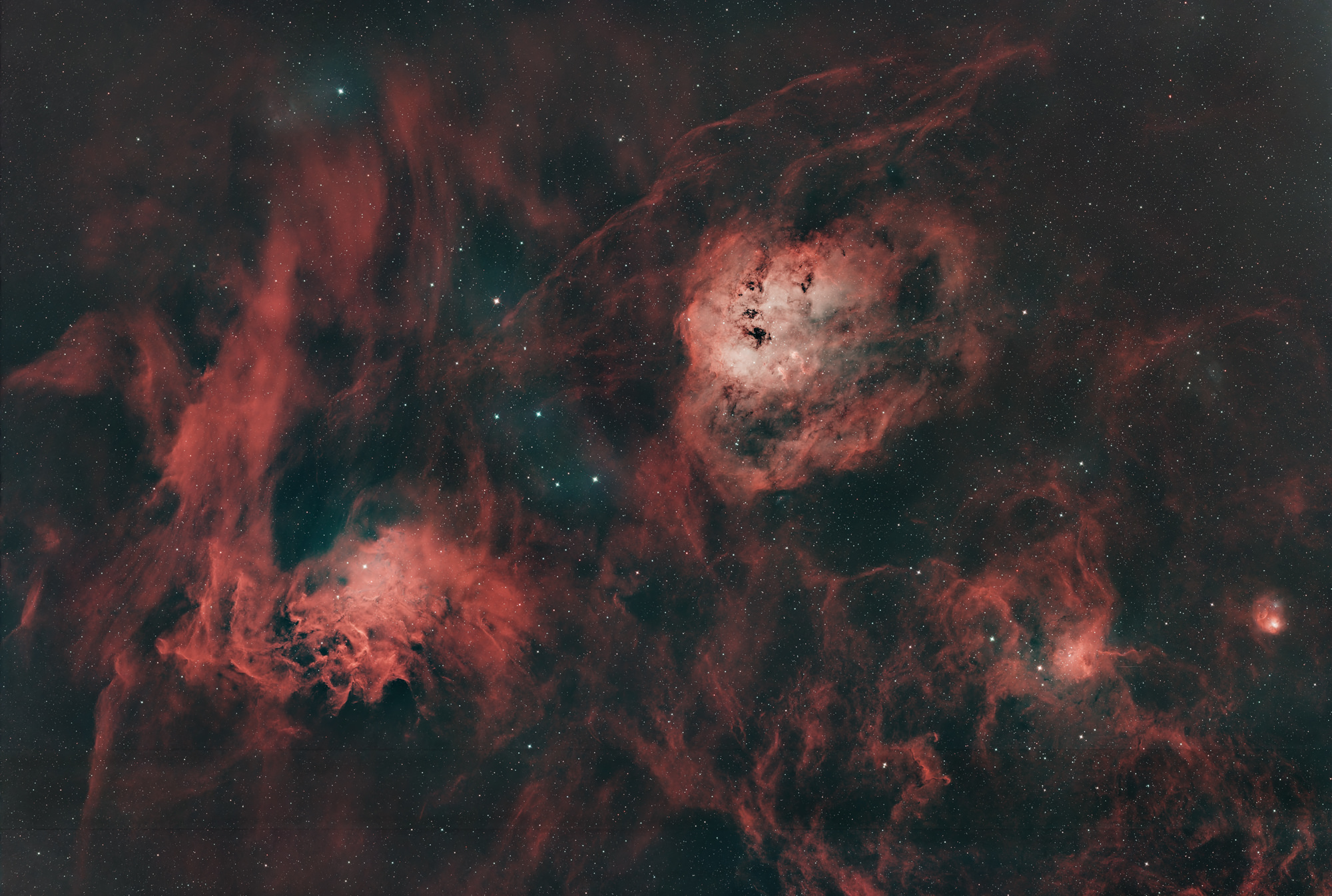 Flaming Star Nebula IC405 on the left and bluish Tadpole Nebula IC410 on the right above in the constellation Auriga